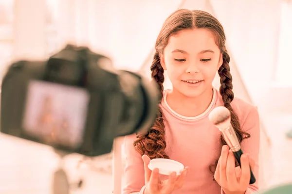 Nice cute girl holding her facial powder — Stock Photo, Image
