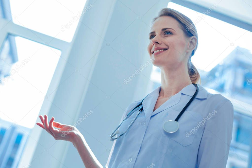 Low angle picture of attractive doctor