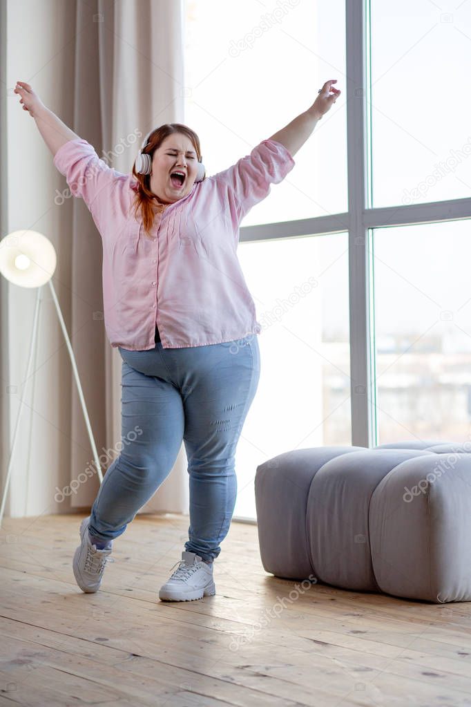 Cheerful nice woman showing her positive emotions