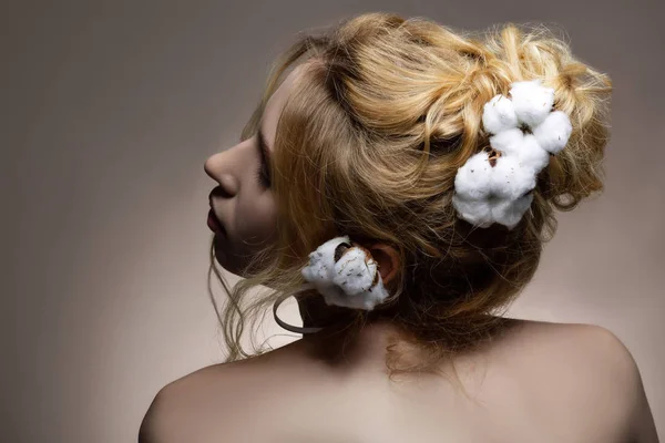 Professional promising model posing with cotton in her hairstyle — Stock Photo, Image