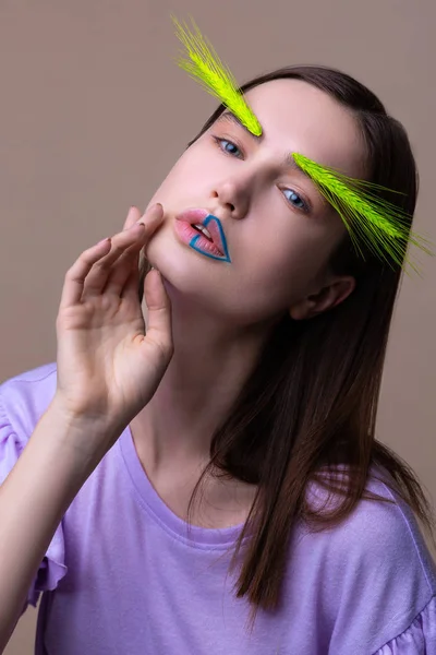 Model posing for cover of ecology magazine with spikelet on eyebrows — Stock Photo, Image