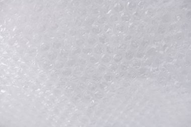 Sivilce tarafı ile şeffaf dokulu plastik şal temizleyin