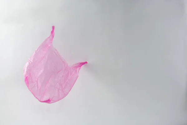 Empty crumpled used plastic bag flying around thrown and forgotten — Stock Photo, Image