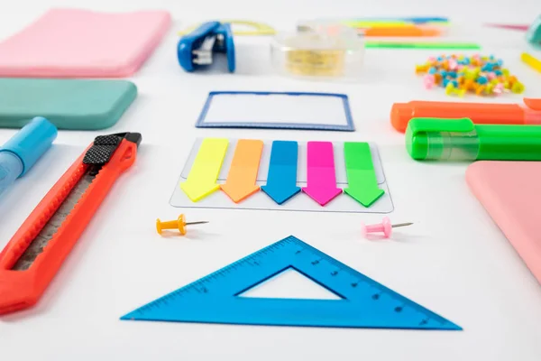 Blue ruler standing with colorful bookmarks with paper knife — Stock Photo, Image