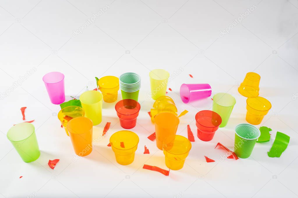 Bunch of colorful plastic cups being broken and thrown
