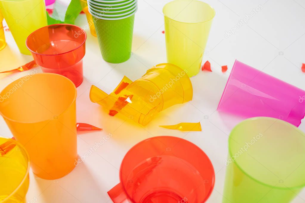 Broken plastic cups with sharp pieces standing together