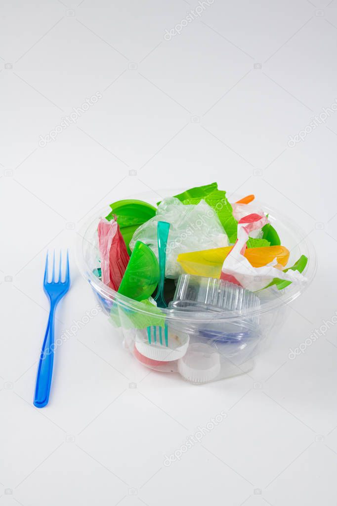 Clear transparent container filled with trash and garbage