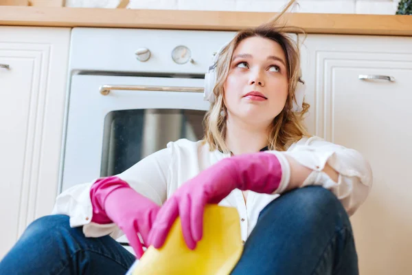 Low angle of a pleasant young woman in the kitchen — Stock Photo, Image