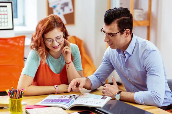 Joyful good looking young people studying together — Stock Photo, Image