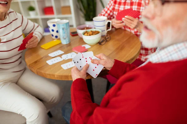 Selective focus of playing cards in male hands — Stock Photo, Image