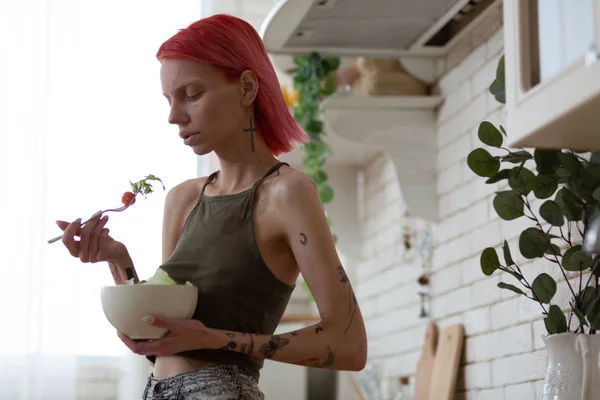 Skinny anorexic woman having no appetite looking at salad — Stock Photo, Image