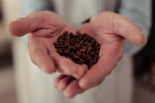 Close up of a handful of coffee beans. — Stock Photo, Image