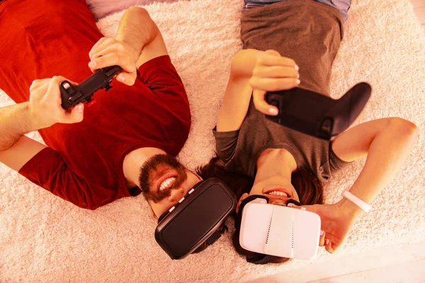 Excited couple playing a new virtual game