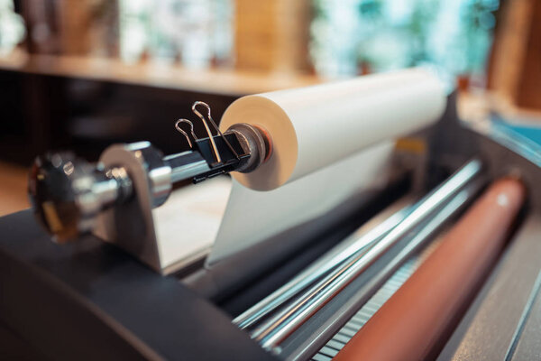Close up of big printing machine standing in the printing office