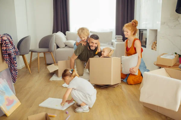 Positive joyful family enjoying their weekend together — Stock Photo, Image