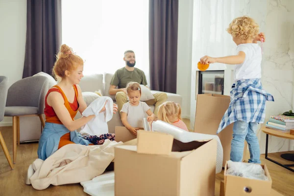 Nice positive kids trying to help their mother — Stock Photo, Image