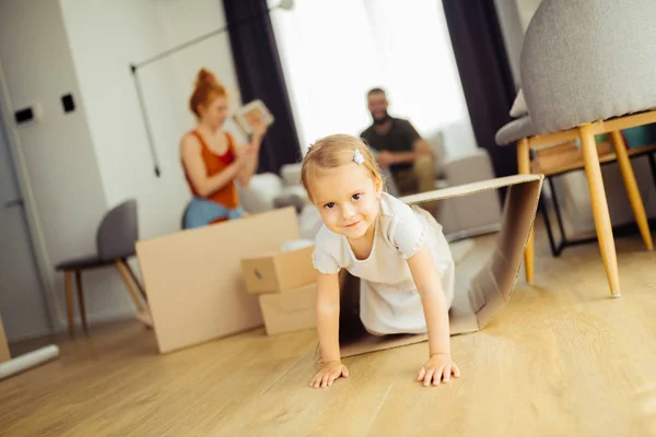 Delighted positive girl playing in the house — Stock Photo, Image