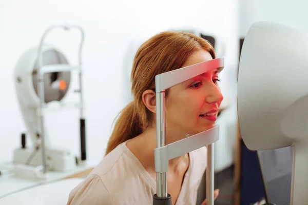 Close up of woman visiting eye specialist at the weekend — Stock Photo, Image