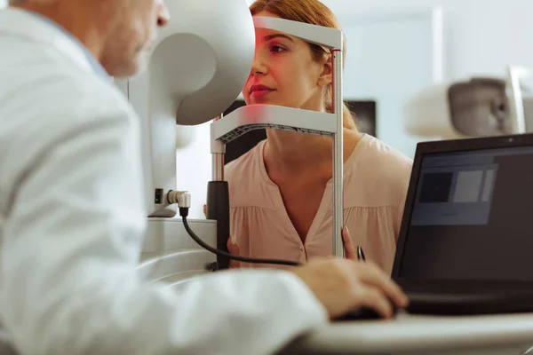 Woman wearing stylish blouse having consultation of eye doctor — Stock Photo, Image