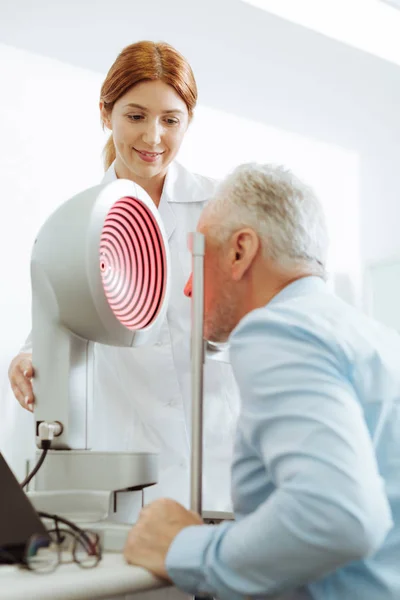 Grey-haired aged man visiting eye specialist every year — Stock Photo, Image