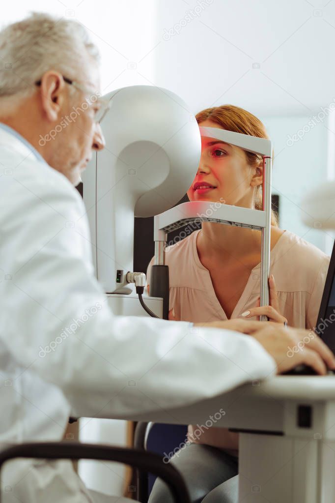 Eye specialist using modern technology for eye examination