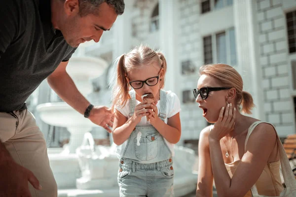 Little girl making herself dirty eating ice-cream. — Stock Photo, Image