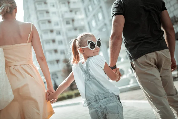 Little girl wearing funny sunglasses on her walk. — Stock Photo, Image