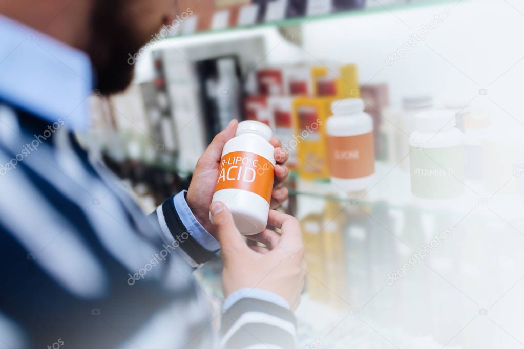 Close up of male hands that holding pills