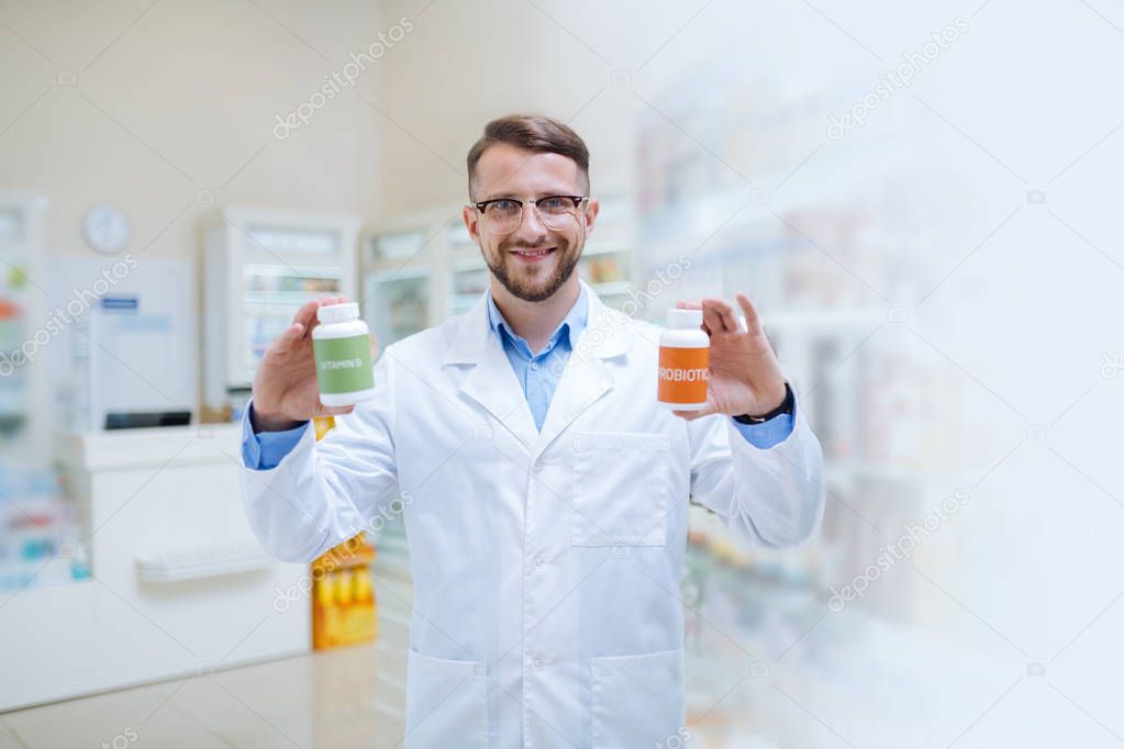 Positive delighted brunette male person posing on camera