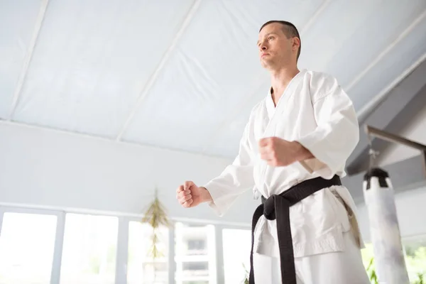 Young but experienced aikido master showing his fists — Stock Photo, Image