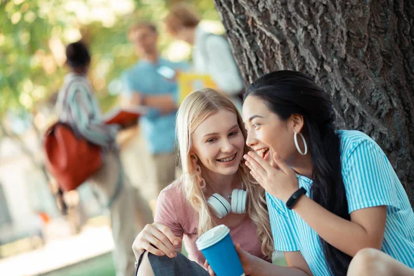 Two gossip girls talking about their friends. — Stock Photo, Image