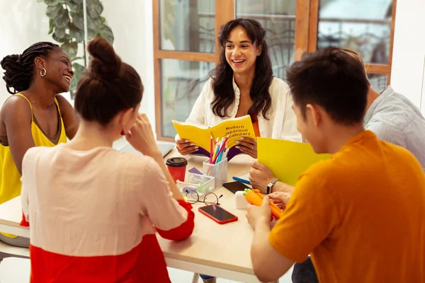 Group of cheerful students studying in language school — Stock Photo, Image