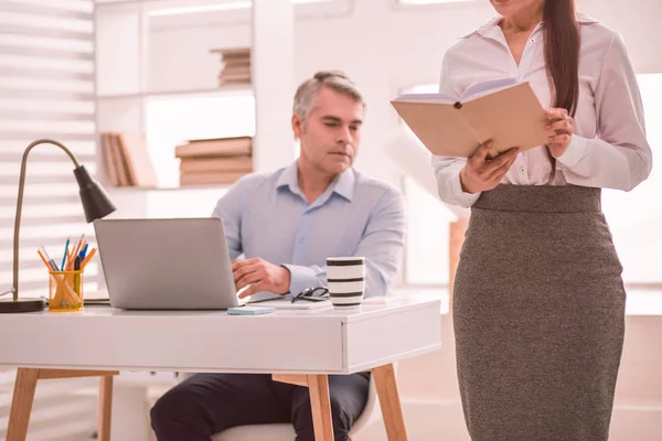 Young woman receiveing indecent sights from her male colleague — Stock Photo, Image