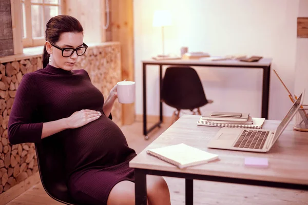 Attractive future mommy caressing her baby belly — Stock Photo, Image