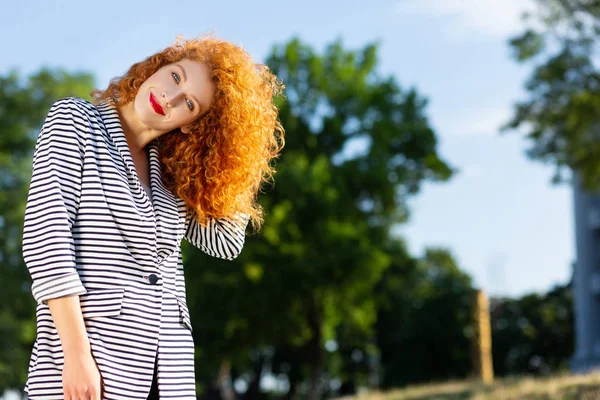 Charming red-haired female looking straight at camera — Stock Photo, Image