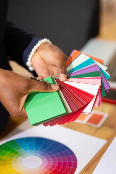 Interior designer looking at great variety of colors for furniture — Stock Photo, Image