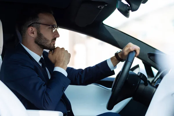 Man feeling thoughtful while standing in traffic jam — Stock Photo, Image