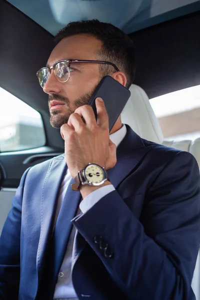 Businessman wearing hand watch calling his secretary — Stock Photo, Image