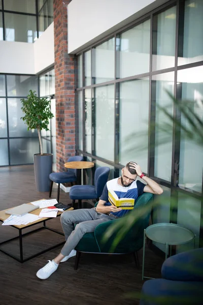 Top view of young promising businessman working and studying — Stock Photo, Image