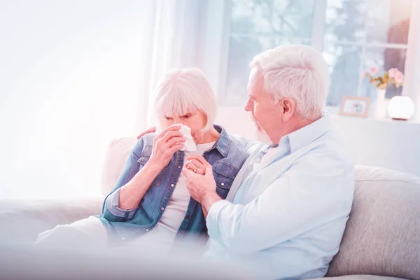 Bearded retired husband supporting his woman crying after bad news — Stock Photo, Image
