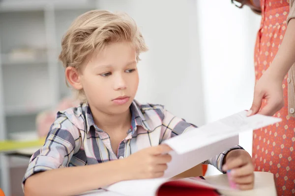 Schoolboy feeling sad after getting bad mark for final test — Stock Photo, Image