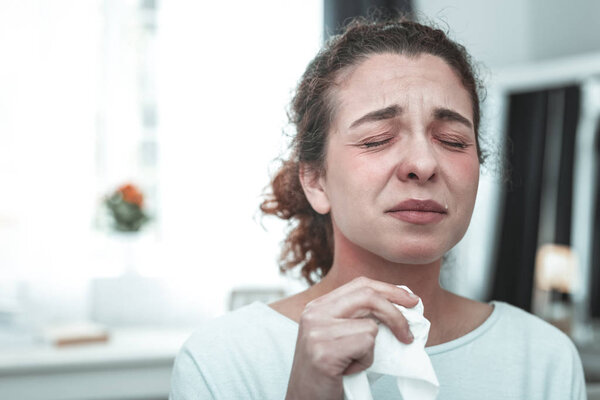 Wife crying while feeling allergic to much dusts at home