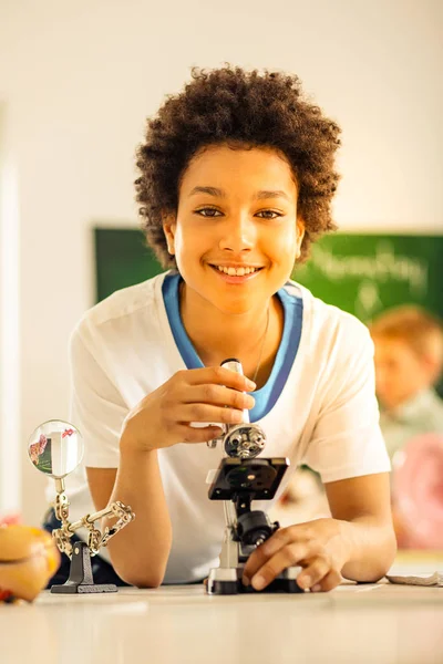 Cheerful teenager visiting classes with great pleasure — Stock Photo, Image