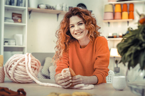 Beautiful young female spending her time in workshop