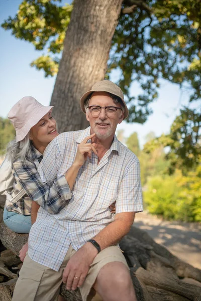 Beaming wife touching face of her handsome bearded man — Stock Photo, Image