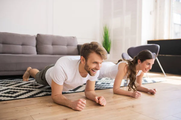 Young couple standing in plank and feeling good — Stock Photo, Image