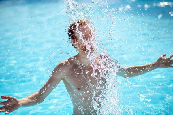 Man waist-deep in water with falling splashes — Stock Photo, Image