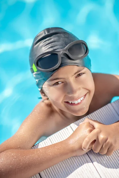 Boy in swimming cap in good mood — Stock Photo, Image