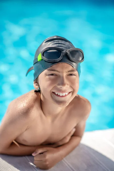 Happy boy in swimming goggles and cap Royalty Free Stock Images