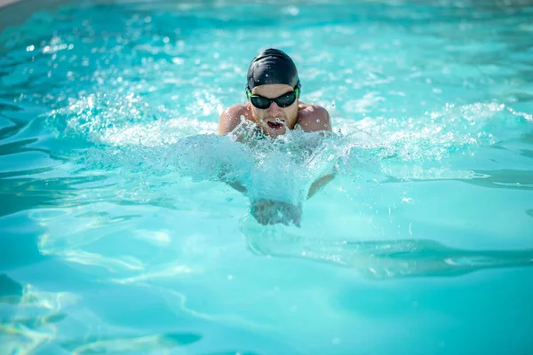 Swimmer moving forward with open mouth in water — Stock Photo, Image